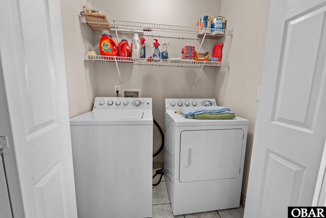 50112 Captains Ct Lot 221, Frisco, NC 27936 - washroom with washing machine and dryer and light tile patterned floors