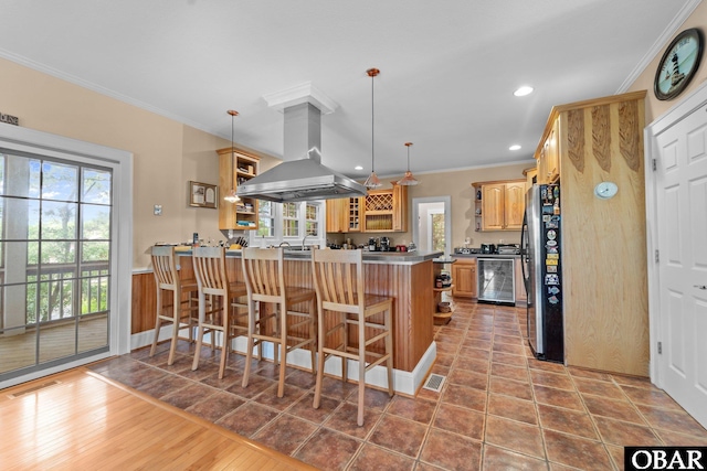 50112 Captains Ct Lot 221, Frisco, NC 27936 - kitchen featuring island range hood, open shelves, a peninsula, freestanding refrigerator, and crown molding