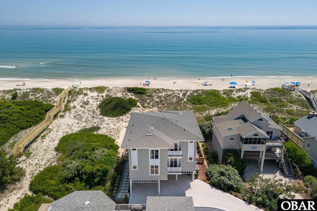 aerial view featuring a view of the beach and a water view