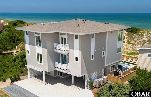 birds eye view of property with a water view