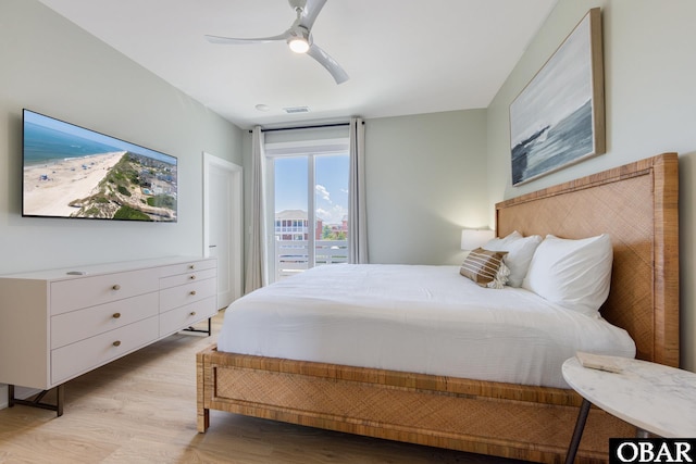 bedroom with light wood-type flooring, ceiling fan, and visible vents