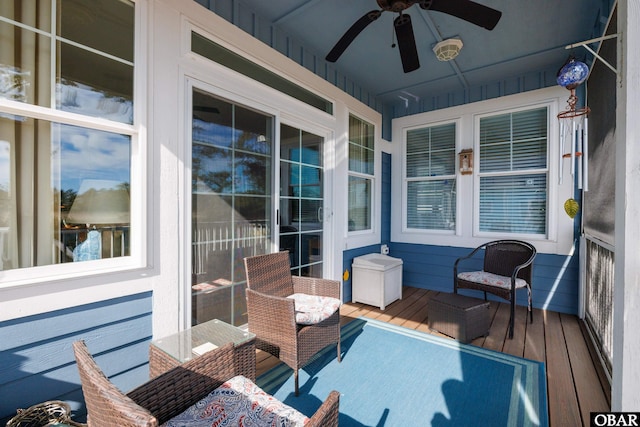 wooden terrace featuring ceiling fan