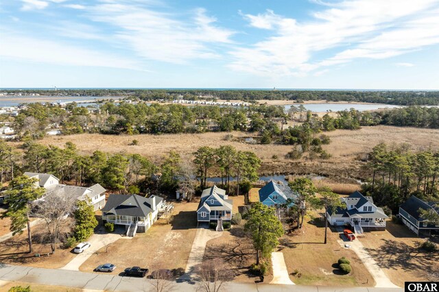 birds eye view of property featuring a water view and a residential view