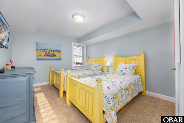 bedroom featuring light carpet and baseboards