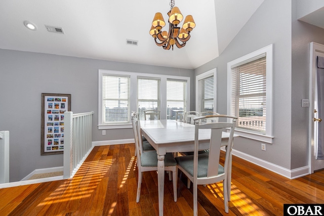 dining space featuring baseboards, visible vents, and wood finished floors