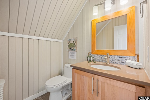 123 Martin Ln Lot 251, Duck, NC 27949 - half bathroom with vanity, lofted ceiling, backsplash, and toilet