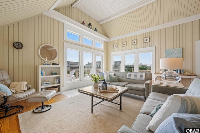 123 Martin Ln Lot 251, Duck, NC 27949 - living area featuring wooden walls, beam ceiling, high vaulted ceiling, and wood finished floors