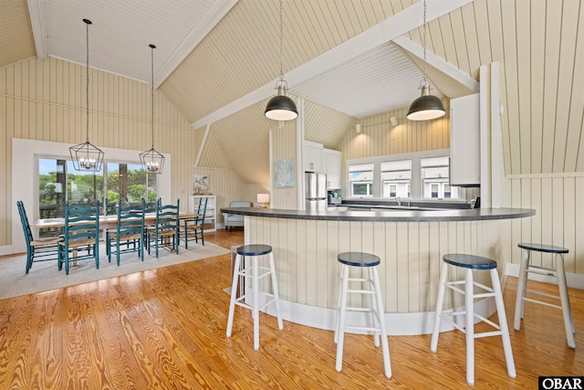 123 Martin Ln Lot 251, Duck, NC 27949 - kitchen with freestanding refrigerator, light wood-style floors, and dark countertops