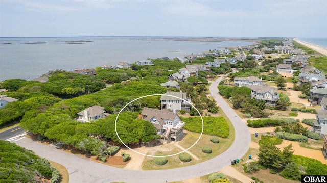 birds eye view of property featuring a water view and a residential view