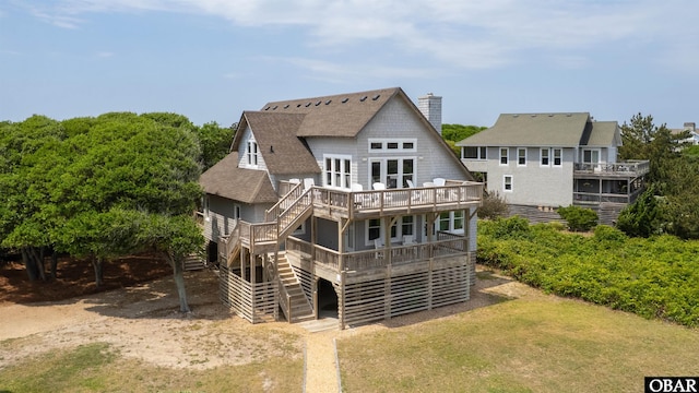 123 Martin Ln Lot 251, Duck, NC 27949 - rear view of house featuring stairs, a shingled roof, a wooden deck, and a chimney