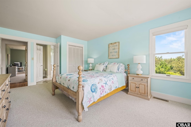 123 Martin Ln Lot 251, Duck, NC 27949 - bedroom featuring baseboards, a closet, visible vents, and light colored carpet
