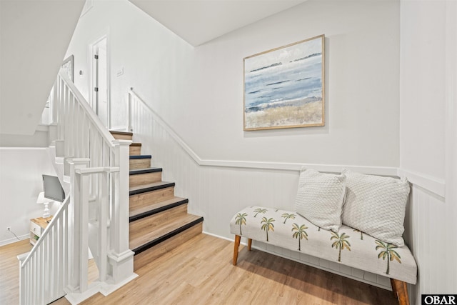 stairway featuring wood finished floors