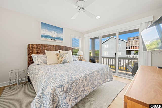 bedroom with access to outside, light wood finished floors, ceiling fan, and baseboards