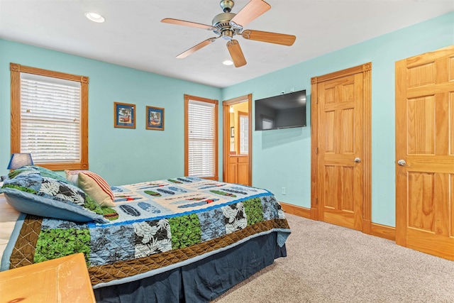 carpeted bedroom featuring ceiling fan, baseboards, and recessed lighting