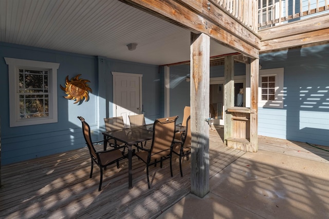 wooden terrace with outdoor dining space