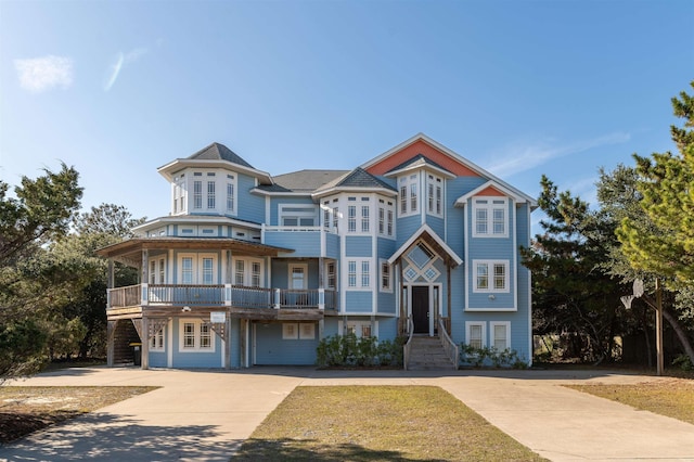 view of front of property featuring french doors and a balcony