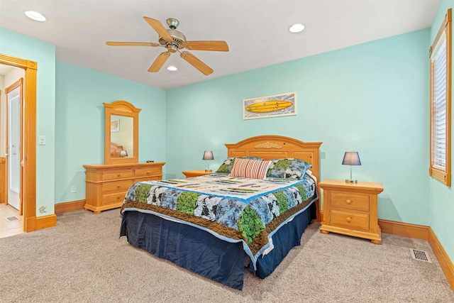 bedroom with light carpet, visible vents, baseboards, and recessed lighting