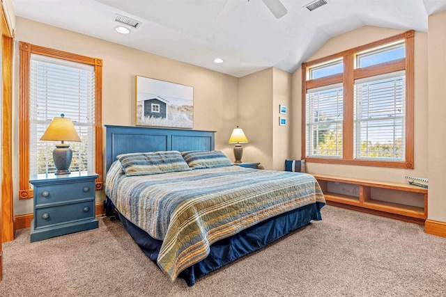 bedroom featuring vaulted ceiling, carpet flooring, visible vents, and a ceiling fan