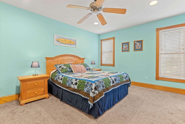 bedroom featuring light carpet, baseboards, a ceiling fan, and recessed lighting