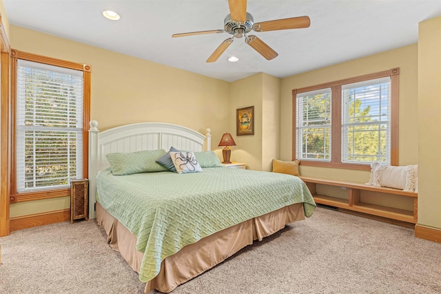 bedroom featuring carpet, multiple windows, baseboards, and recessed lighting