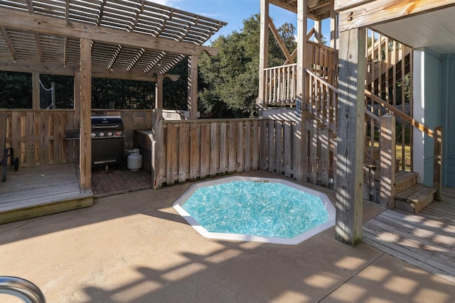 view of pool featuring a deck, a patio area, grilling area, and a pergola