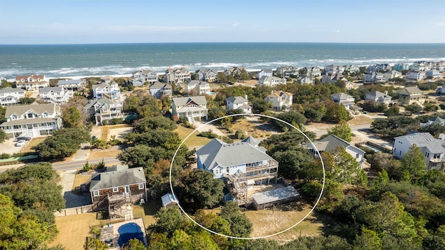 birds eye view of property featuring a residential view and a water view