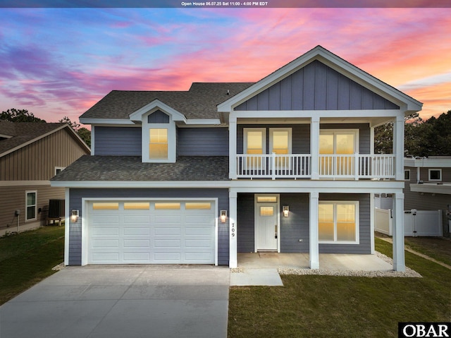 709 Zen Ln Lot 61, Kill Devil Hills, NC 27948 - view of front of home featuring concrete driveway, a porch, roof with shingles, and a front yard