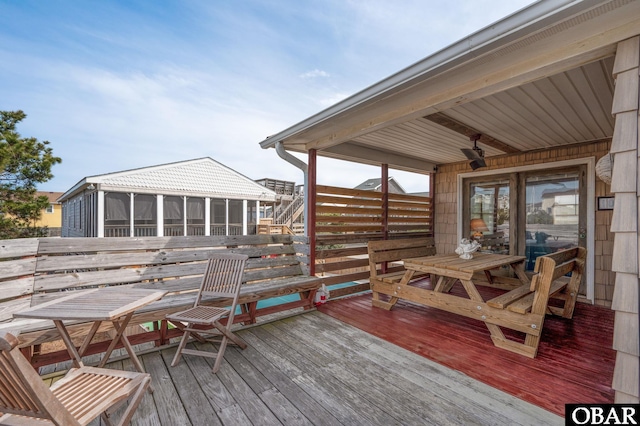 deck with a sunroom