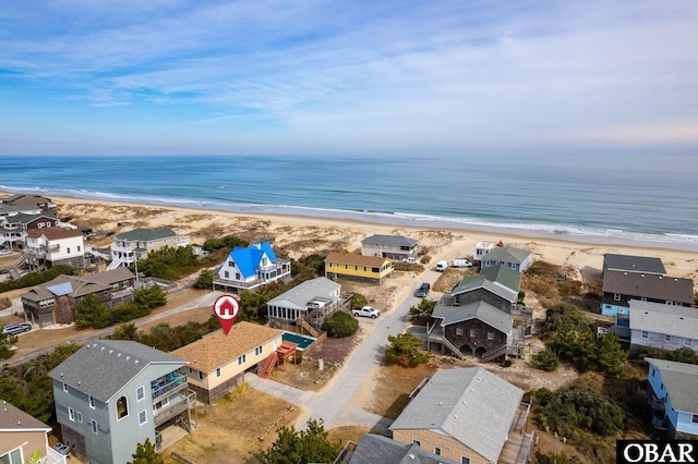 aerial view featuring a water view and a beach view