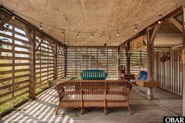 exterior space with hardwood / wood-style floors, wooden ceiling, and rail lighting