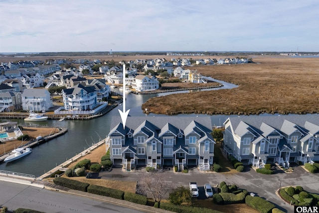 aerial view with a water view and a residential view