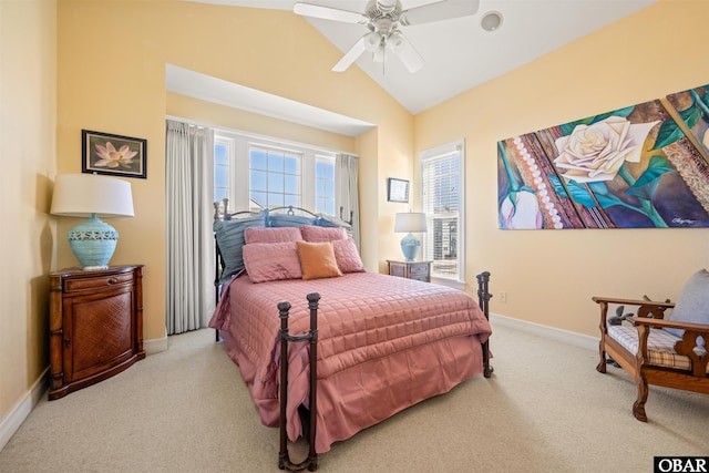 bedroom with ceiling fan, baseboards, vaulted ceiling, and light colored carpet