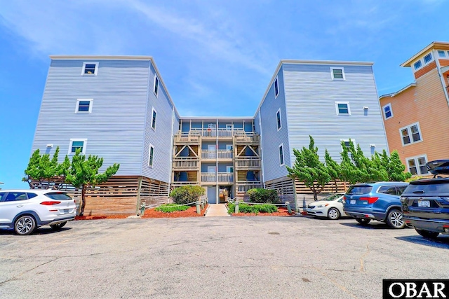 1401 N Virginia Dare Trl Unit # 5C, Kill Devil Hills, NC 27948 - view of apartment building / complex with uncovered parking
