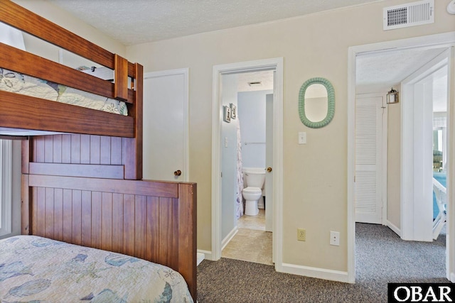 1401 N Virginia Dare Trl Unit # 5C, Kill Devil Hills, NC 27948 - bedroom with carpet floors, baseboards, and a textured ceiling