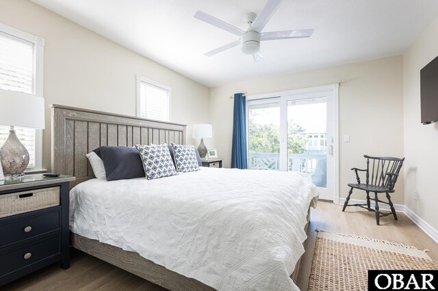 bedroom featuring baseboards, a ceiling fan, light wood-style flooring, and access to exterior