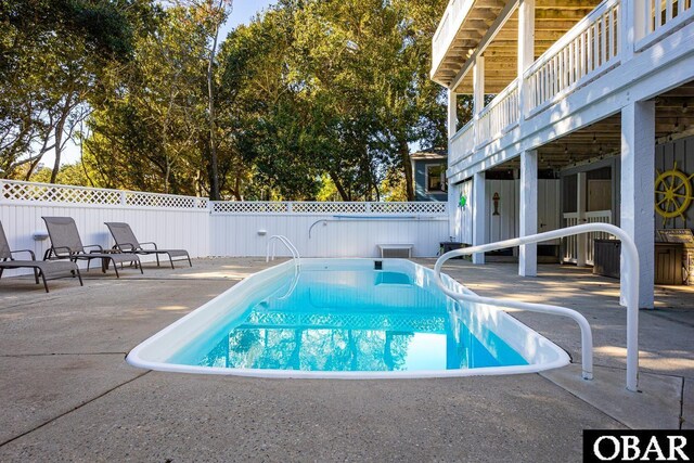 view of pool with a patio area, a fenced backyard, and a fenced in pool