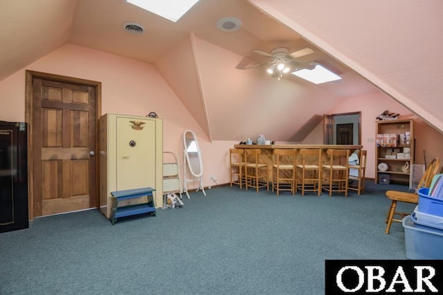 128 Daphne Ln Lot 17, Manteo, NC 27954 - sitting room featuring a skylight, lofted ceiling, carpet flooring, and ceiling fan