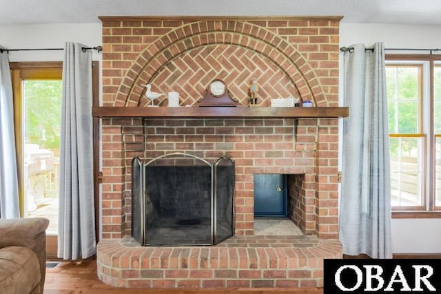 128 Daphne Ln Lot 17, Manteo, NC 27954 - detailed view of a brick fireplace and wood finished floors