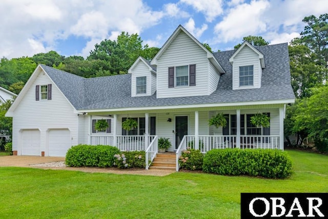 128 Daphne Ln Lot 17, Manteo, NC 27954 - view of front of home with roof with shingles, a porch, a front yard, concrete driveway, and a garage