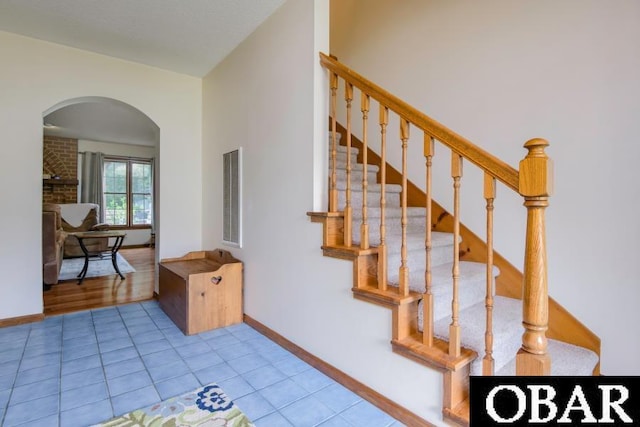 128 Daphne Ln Lot 17, Manteo, NC 27954 - stairway featuring arched walkways and tile patterned floors