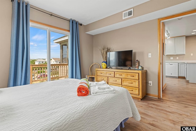 bedroom featuring light wood-style floors, access to outside, visible vents, and baseboards