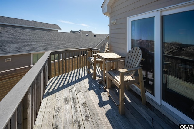 wooden deck featuring outdoor dining space