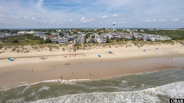 bird's eye view featuring a residential view, a water view, and a beach view