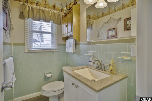 400 Driftwood Dr Lot 168, Elizabeth City, NC 27909 - bathroom featuring tile walls, vanity, toilet, and a wainscoted wall