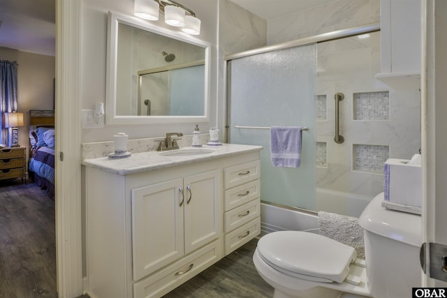 400 Driftwood Dr Lot 168, Elizabeth City, NC 27909 - bathroom with bath / shower combo with glass door, vanity, connected bathroom, wood finished floors, and toilet