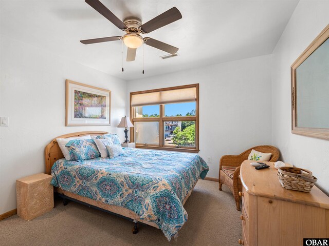 2250 Ocean Pearl Rd Lot 13, Corolla, NC 27927 - carpeted bedroom with baseboards and a ceiling fan