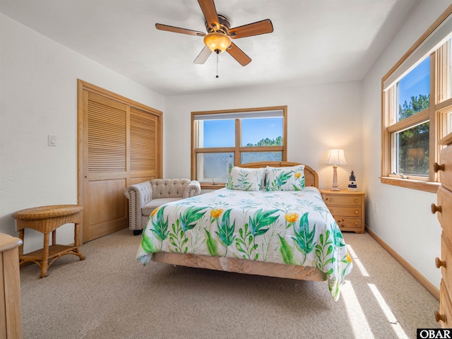 2250 Ocean Pearl Rd Lot 13, Corolla, NC 27927 - carpeted bedroom with a closet, baseboards, and ceiling fan