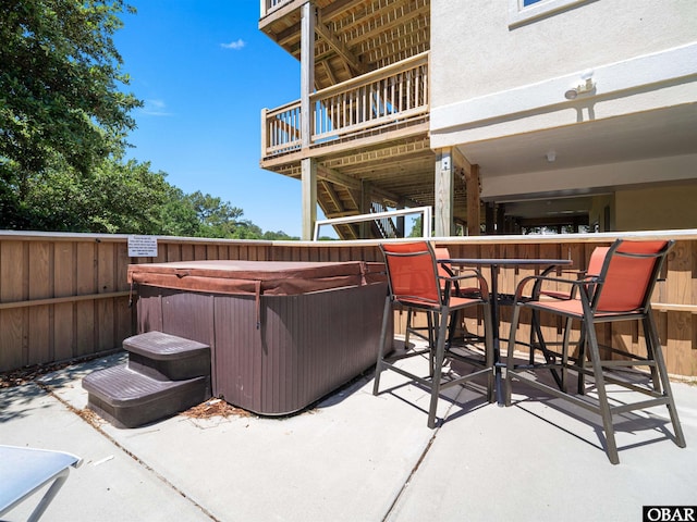 2250 Ocean Pearl Rd Lot 13, Corolla, NC 27927 - view of patio / terrace with a hot tub and a balcony