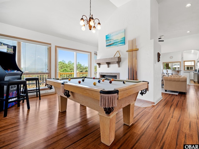 2250 Ocean Pearl Rd Lot 13, Corolla, NC 27927 - recreation room featuring pool table, healthy amount of natural light, a chandelier, wood finished floors, and high vaulted ceiling