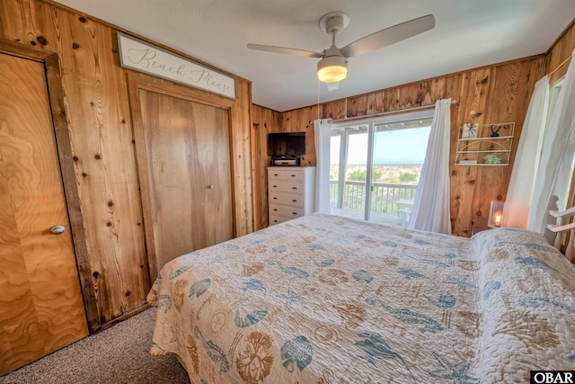 42075 Ocean View Dr Lot 3, Avon, NC 27943 - carpeted bedroom featuring wood walls, a closet, and a ceiling fan